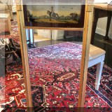 D29. Gilt mirror with reverse painted glass panel. 